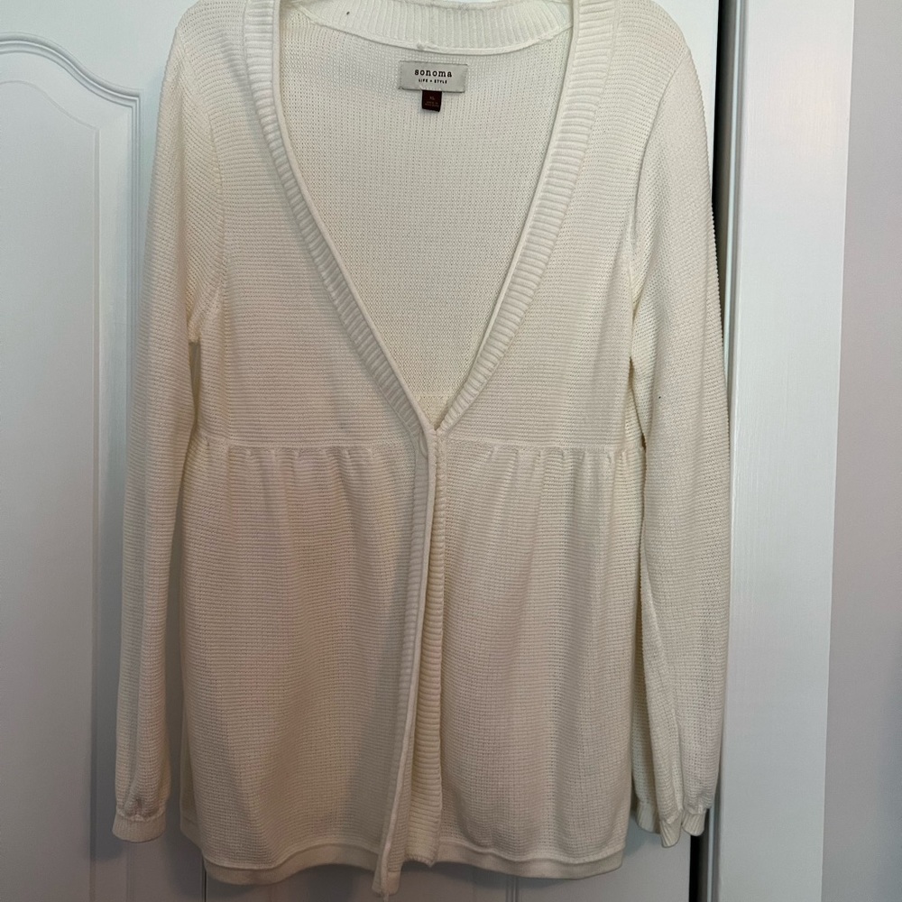 Off white sweater, baby doll style